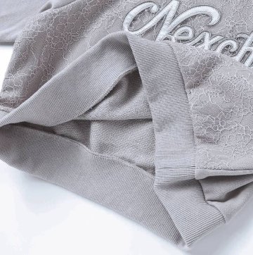 nexchic (ネクシック) 「レースonロゴショート丈トレーナー」(130-150cm) の画像