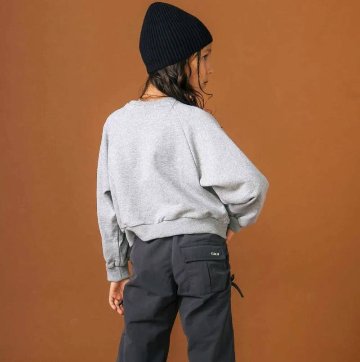 nexchic (ネクシック) 「レースonロゴショート丈トレーナー」(130-150cm) の画像