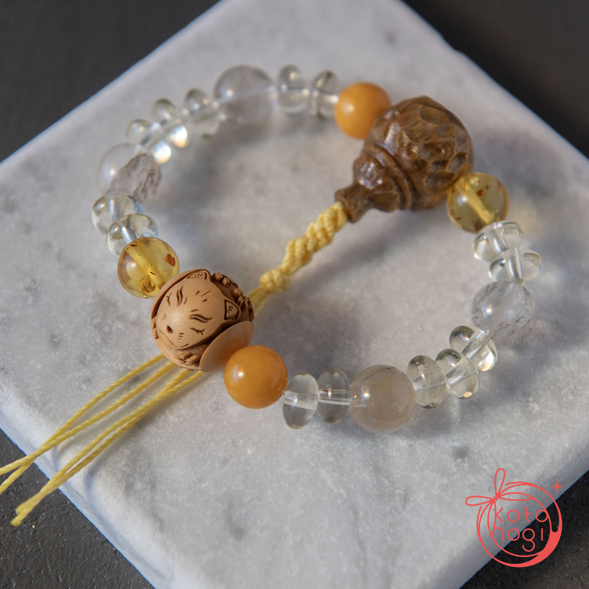 九尾の狐と稲荷面のお守りブレスレット「甘露」檀香樹 柘植 ハニーアンバー バルティックアンバー デンドリティッククォーツ レモンクォーツの画像